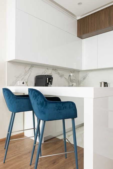 Increase the height of your kitchen cabinets by adding shelves or risers to make the contents easier to reach